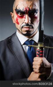 Man with face paint and sword