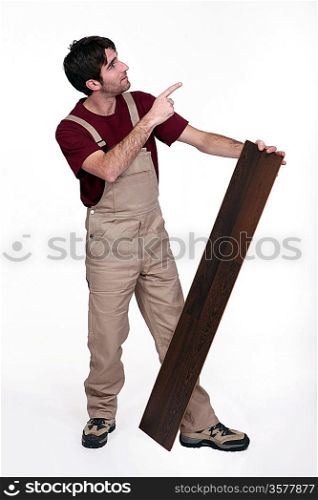 Man with flooring pointing up
