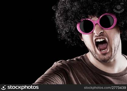 Man with funny sunglasses is grooving over black background