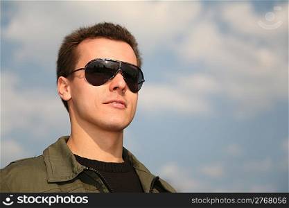 man with glasses on sky