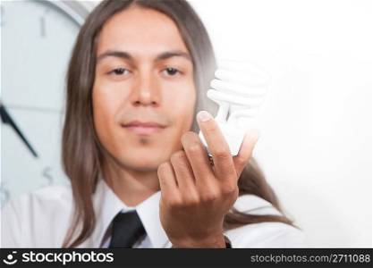 Man with glowing energy efficient lightbulb