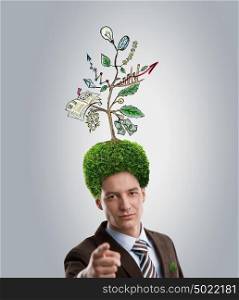 Man with green tree growing instead of hair. Environment friendly business concept