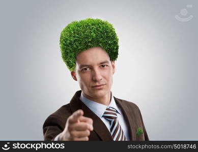 Man with green tree instead of hair. Ecological mind concept