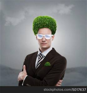 Man with greenery on his head. Loving nature and taking care of ecology concept