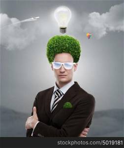 Man with greenery on his head. Loving nature and taking care of ecology concept