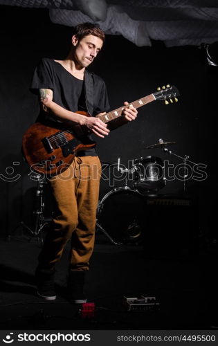 Man with guitar during concert