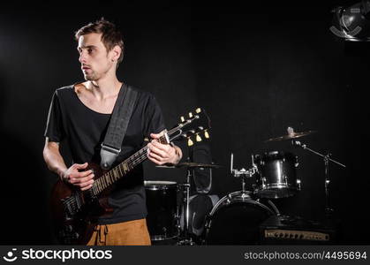 Man with guitar during concert