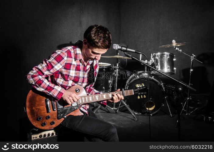 Man with guitar during concert