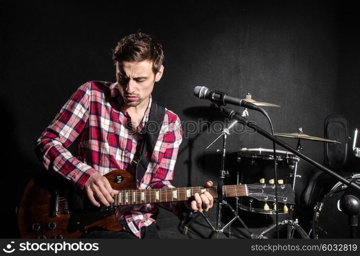 Man with guitar during concert