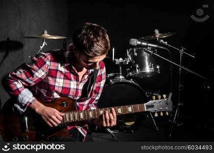 Man with guitar during concert
