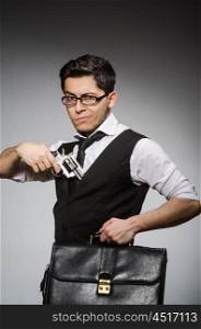 Man with gun and briefcase