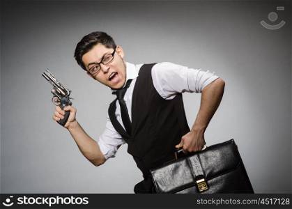 Man with gun and briefcase
