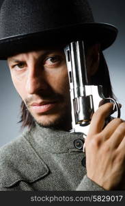 Man with gun and vintage hat