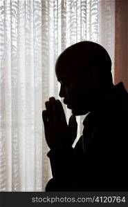 Man With Hands in Prayer
