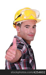 Man with hard hat and goggles giving thumbs-up