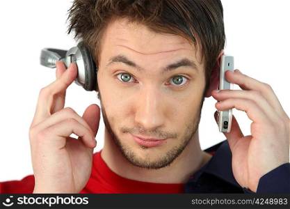 Man with headphones and cellphone