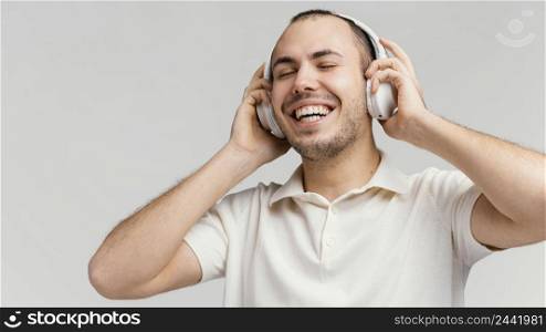 man with headphones laughing