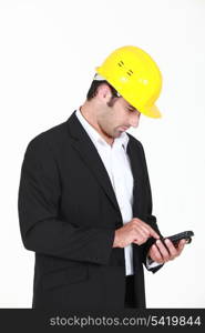 Man with helmet and cell phone