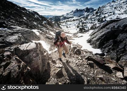 Man with hiking equipment walking in Sierra Nevada mountains,California,USA