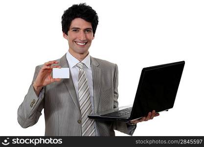 Man with laptop and calling card
