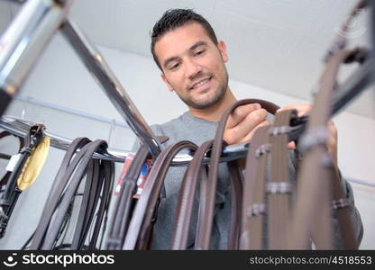 man with leather belts