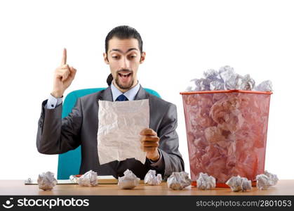 Man with lots of wasted paper