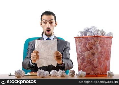 Man with lots of wasted paper