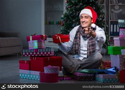 Man with many christmas gifts in boxes
