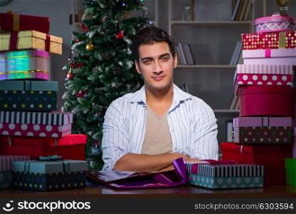 Man with many christmas gifts in boxes. The man with many christmas gifts in boxes