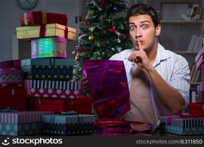Man with many christmas gifts in boxes. The man with many christmas gifts in boxes