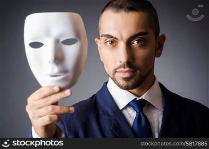 Man with masks in hypocrisy concept