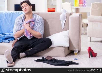 Man with mess at home after house party