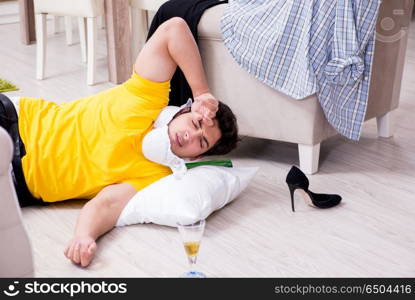 Man with mess at home after house party