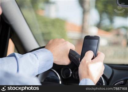 Man with mobile distracted and driving your car