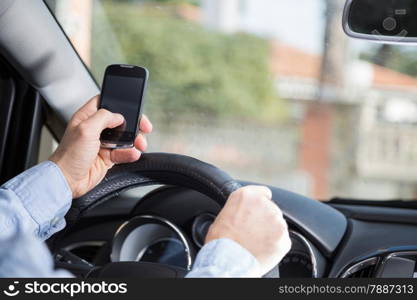 Man with mobile distracted and driving your car