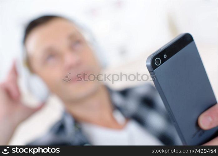 man with mobile phone and headphones