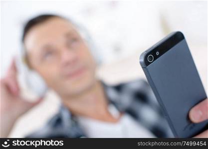 man with mobile phone and headphones