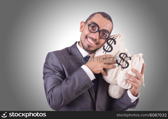 Man with money sacks on white