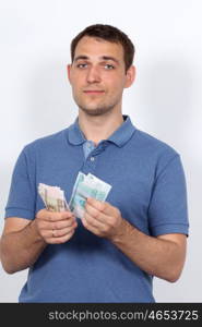 Man with money showing thumbs up