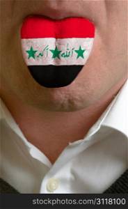 man with open mouth spreading tongue colored in iraq flag as symbol of values like teaching, learning, multilingual speaking of different languages