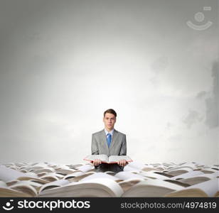 Man with opened book. Young businessman holding in hands blank opened book