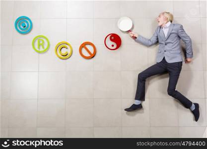 Man with pan. Young funny businessman running with pan in hand