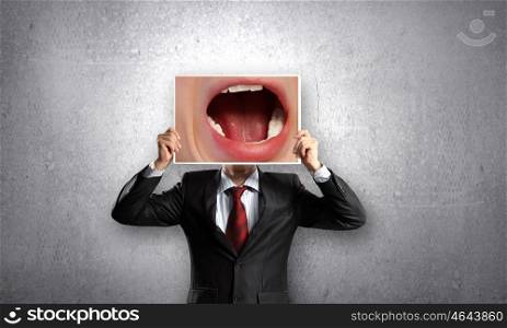 Man with photo. Unrecognizable businessman holding photo with screaming mouth