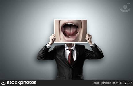 Man with photo. Unrecognizable businessman holding photo with screaming mouth