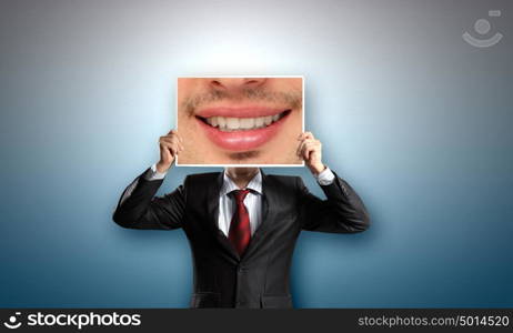 Man with photo. Unrecognizable businessman holding photo with smiling mouth