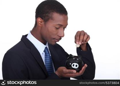 Man with pig-shaped piggy bank