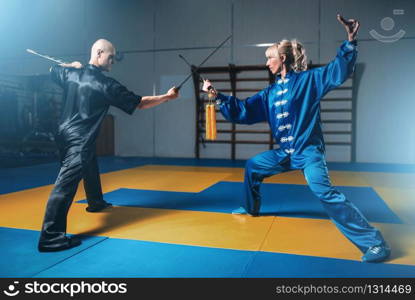 Man with ping pong racket plays the ball off, image in action, workout indoors. Male person in sportswear, training in table tennis club