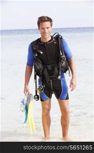 Man With Scuba Diving Equipment Enjoying Beach Holiday