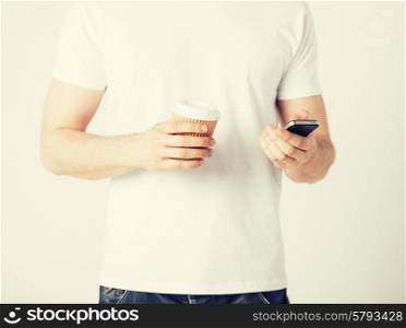 man with smartphone and take away coffee cup
