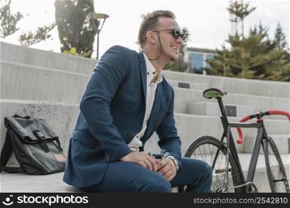 man with sunglasses sitting his bike